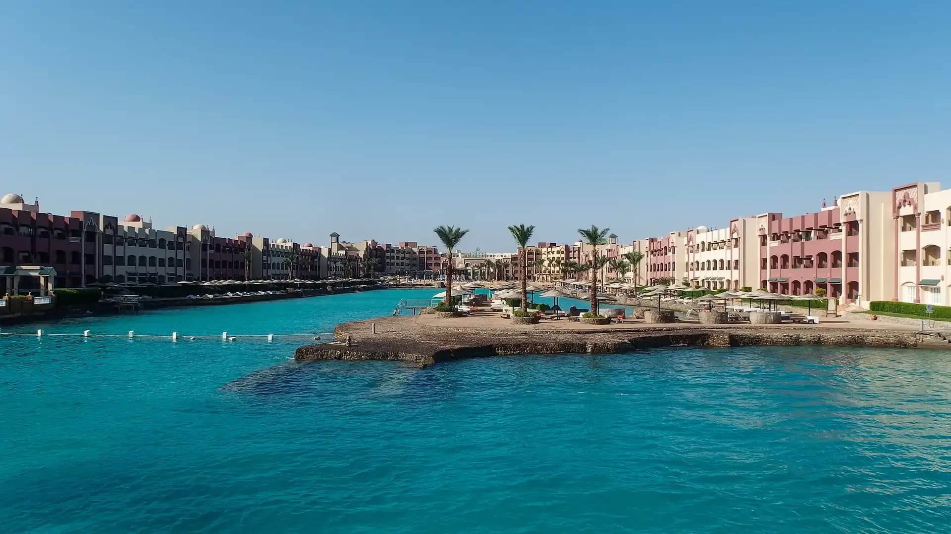 Hotel buildings around a turquoise lagoon in Hurghada