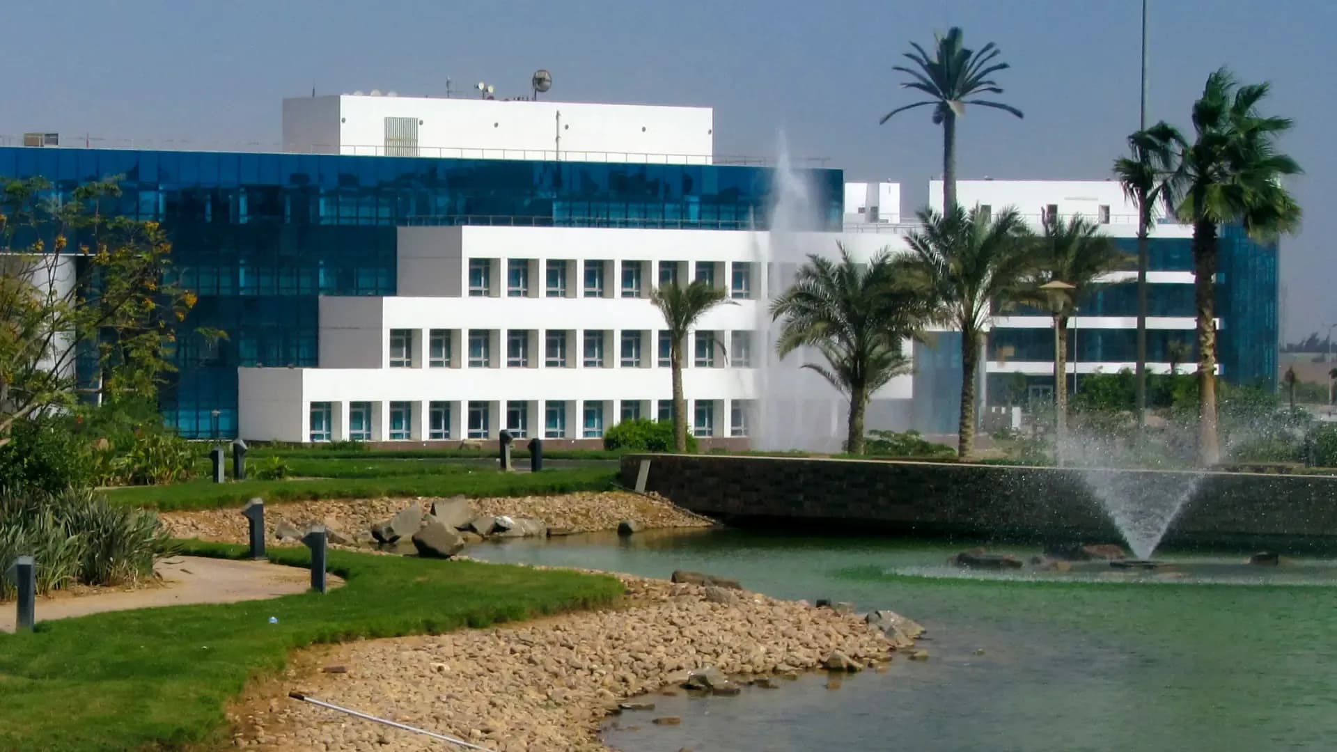 Office buildings by a lake in the Smart Village business park, Cairo